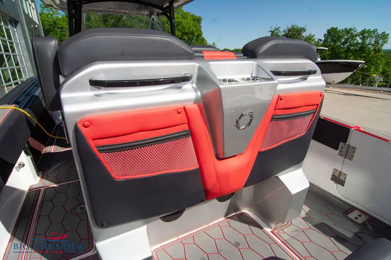 Slide: The Image of 2021 Fountain 38 SC boat interior with red and black seating and storage compartments. - 24