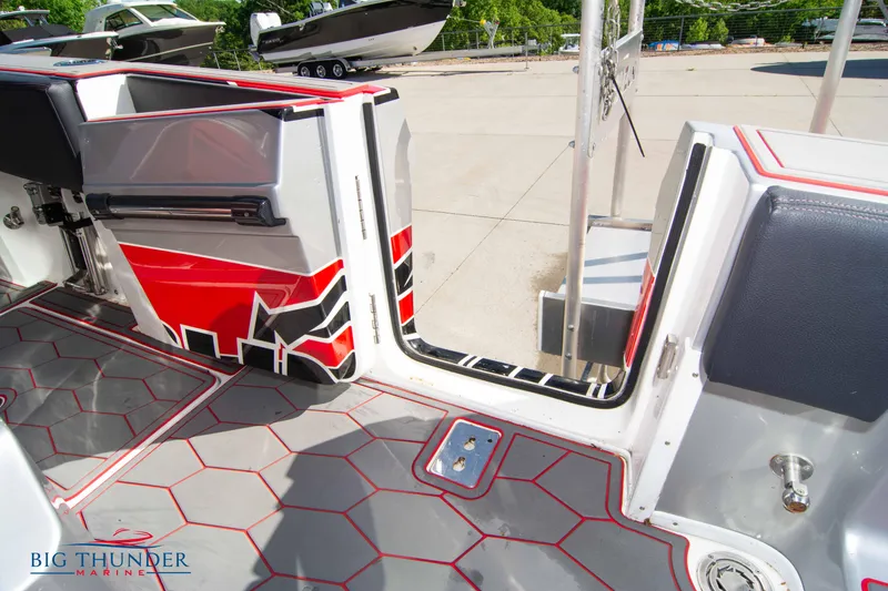 Slide: The Image of 2021 Fountain 38 SC boat interior with red and gray accents at Big Thunder Marine. - 25
