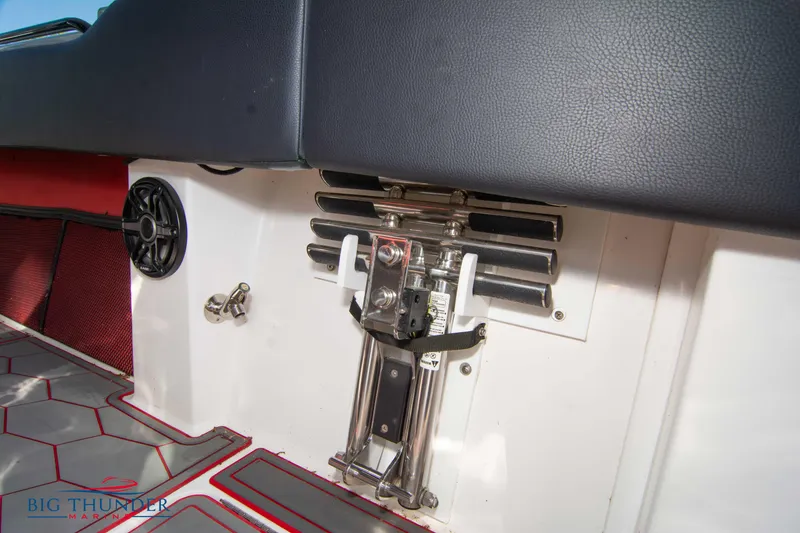 Slide: The Image of 2021 Fountain 38 SC boat interior with seating and control mechanisms. - 26