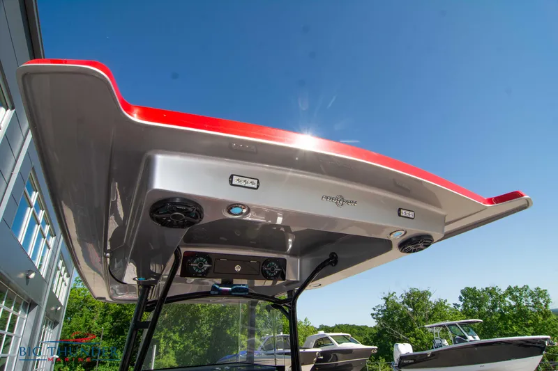 Slide: The Image of 2021 Fountain 38 SC boat with red and white T-top under clear blue sky. - 30