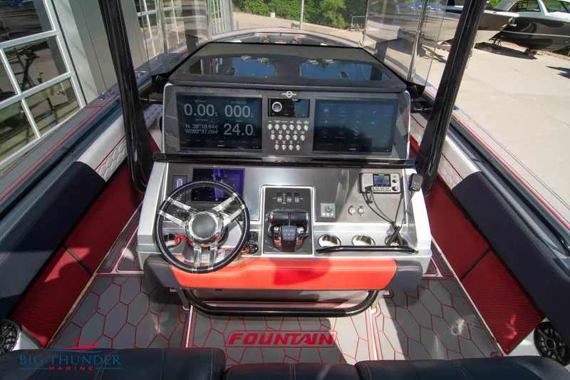 Slide: The Image of 2021 Fountain 38 SC boat dashboard with advanced navigation and control systems. - 33