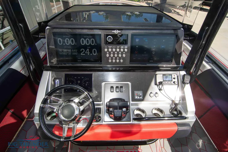 Slide: The Image of 2021 Fountain 38 SC boat dashboard with advanced navigation and control systems. - 34