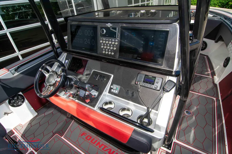 Slide: The Image of 2021 Fountain 38 SC boat dashboard with advanced navigation system and modern controls. - 35