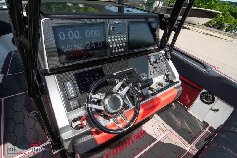 Slide: The Image of 2021 Fountain 38 SC boat dashboard with advanced navigation and control systems. - 36