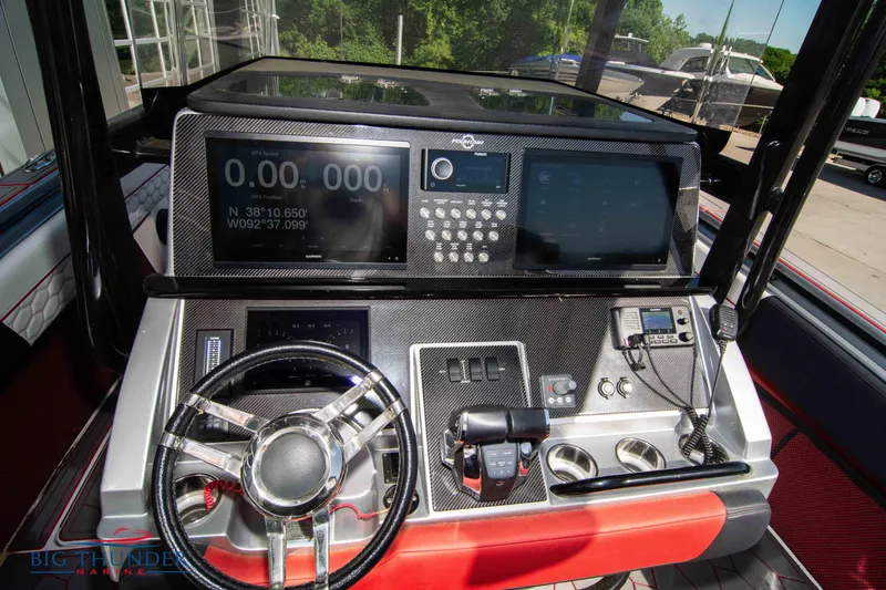 Slide: The Image of 2021 Fountain 38 SC boat dashboard with advanced navigation and control systems. - 37