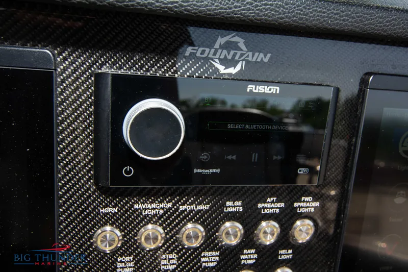Slide: The Image of Fountain 38 SC 2021 dashboard with Fusion audio system and control panel. - 43