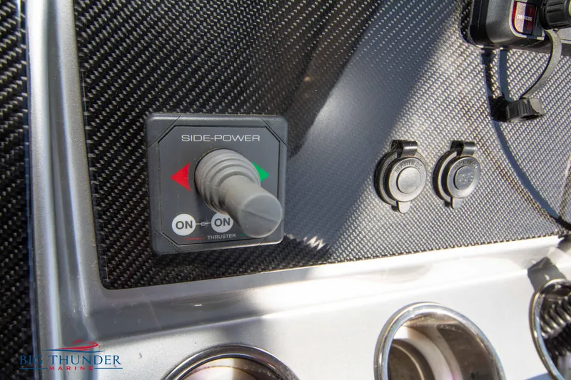 Slide: The Image of Close-up of 2021 Fountain 38 SC boat control panel with Side-Power thruster joystick. - 46