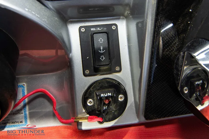 Slide: The Image of Control panel of a 2021 Fountain 38 SC boat with windlass and ignition switch. - 47