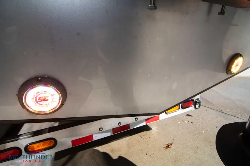 Slide: The Image of Close-up of 2021 Fountain 38 SC boat trailer lights and rear hull. - 9