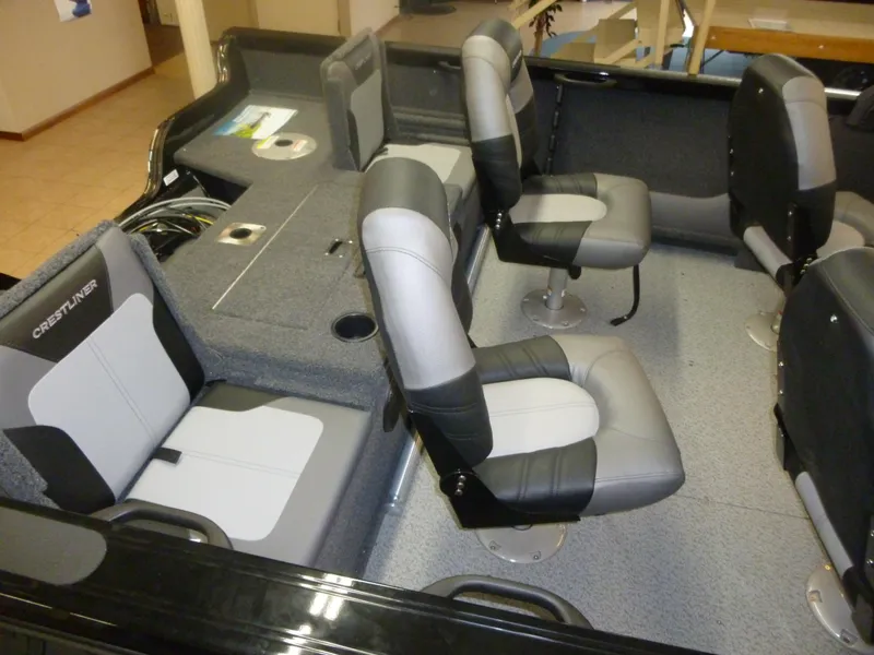 Slide: The Image of 2022 Crestliner 1750 Super Hawk WT JS boat interior with gray and black seating. - 3