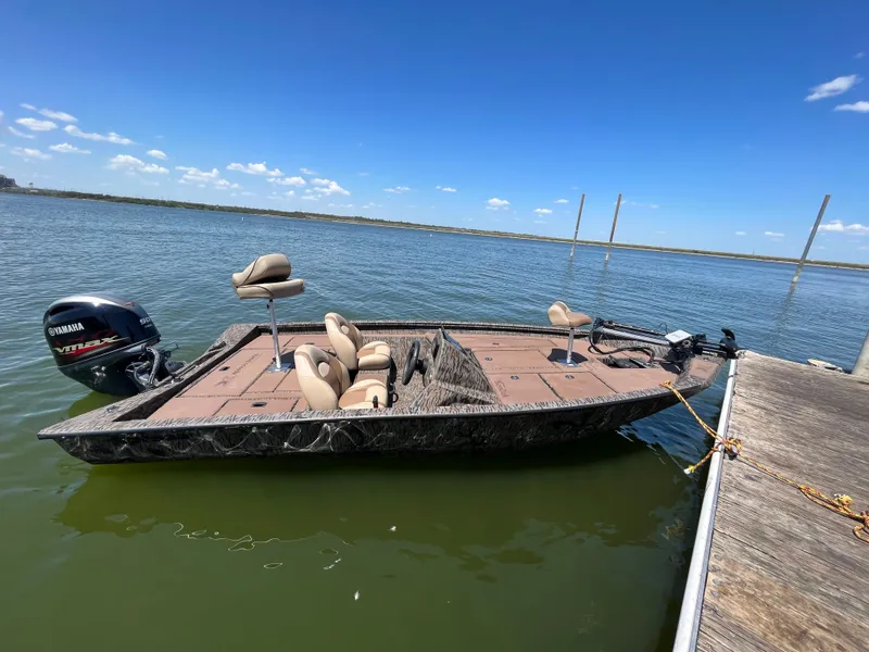 Slide: The Image of 2024 Xpress HyperLift H17 boat docked on a sunny lake. - 12
