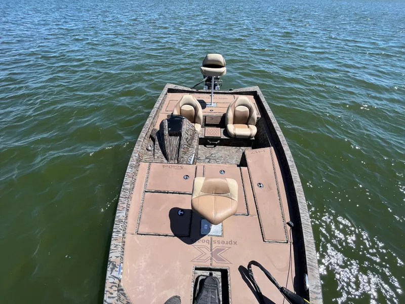 Slide: The Image of 2024 Xpress HyperLift H17 boat on water, featuring comfortable seating and spacious deck. - 14