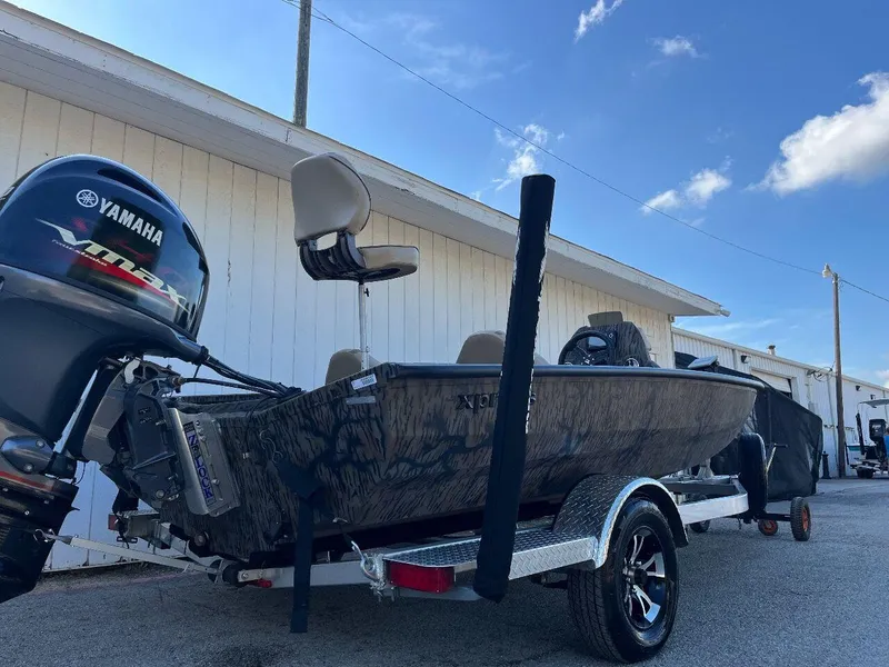 Slide: The Image of 2024 Express HyperLift H17 boat on trailer with Yamaha outboard motor. - 17