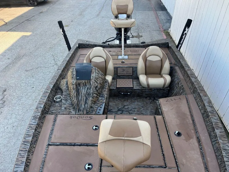 Slide: The Image of 2024 Express HyperLift H17 fishing boat with tan and brown seating. - 24