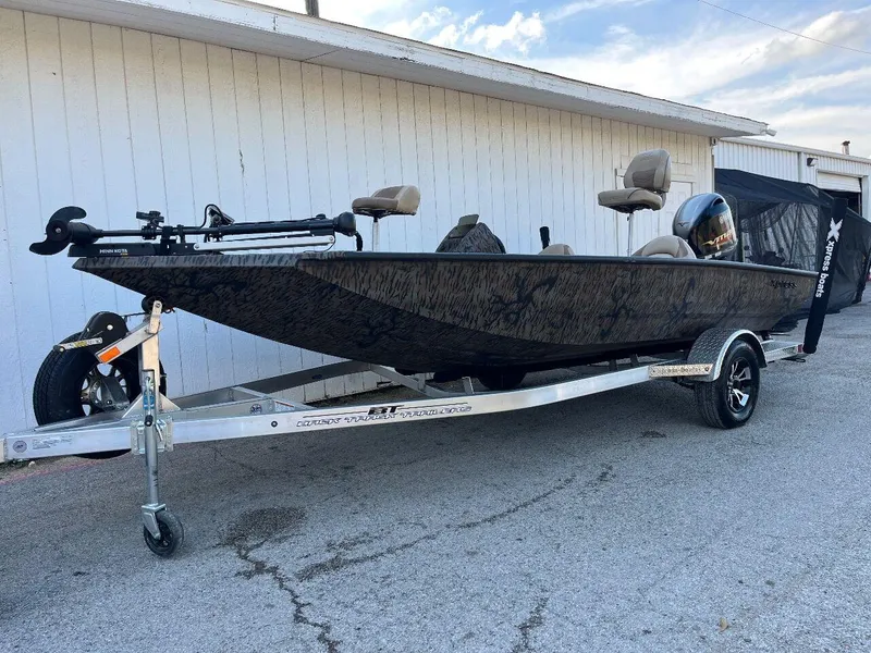 Slide: The Image of 2024 Express HyperLift H17 boat on trailer, parked outside. - 33