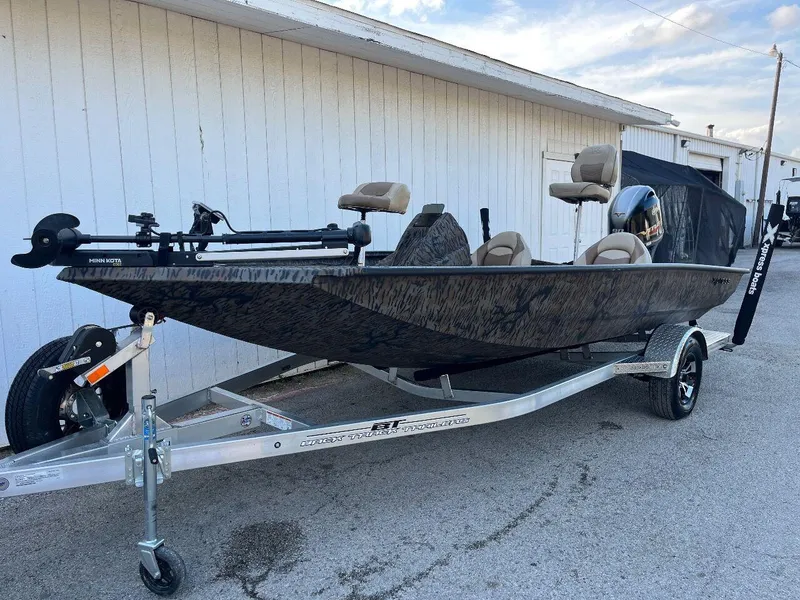 Slide: The Image of 2024 Express HyperLift H17 boat on trailer, parked outdoors. - 34