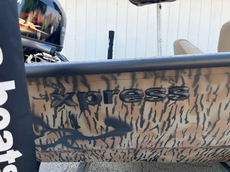 Slide: The Image of 2024 Express HyperLift H17 boat with camouflage design and logo. - 36