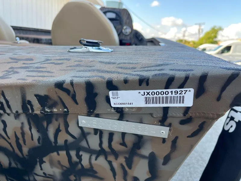Slide: The Image of 2024 Express HyperLift H17 boat with camouflage pattern and identification tags. - 37