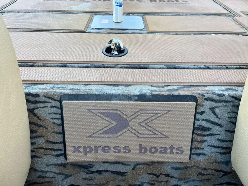 Slide: The Image of 2024 Express HyperLift H17 boat interior with Xpress Boats logo. - 51