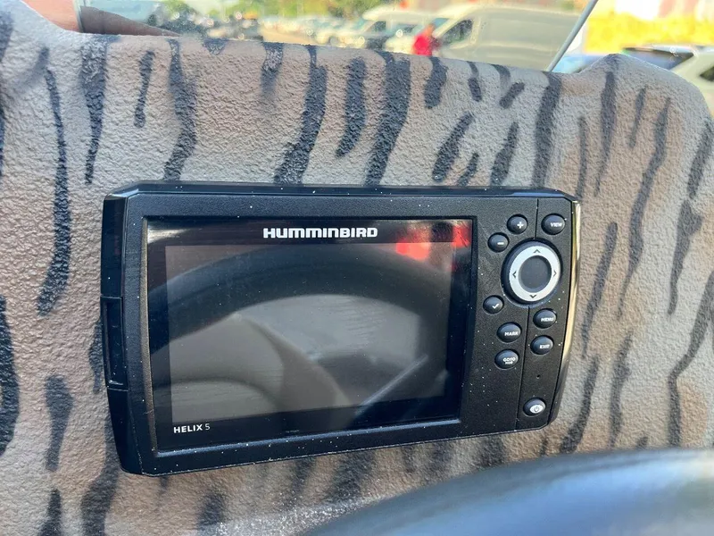 Slide: The Image of Humminbird Helix 5 fish finder on 2024 Express HyperLift H17 boat dashboard. - 53