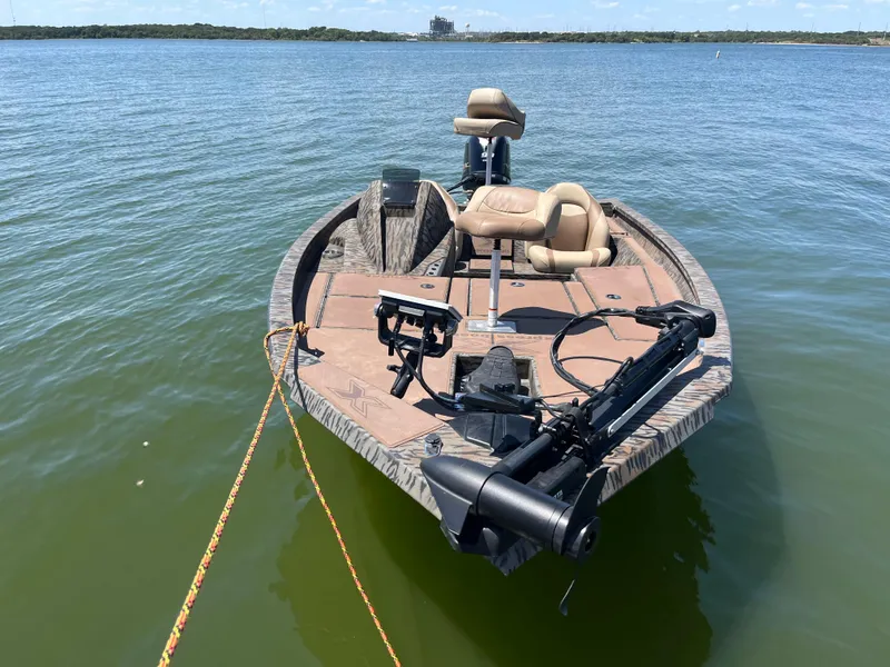 Slide: The Image of 2024 Xpress HyperLift H17 fishing boat on calm water. - 8