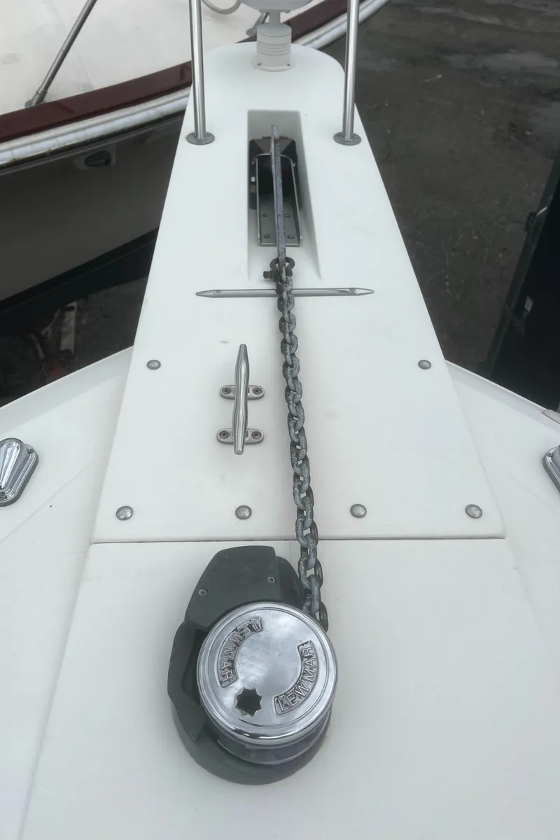 Slide: The Image of Bow of 2000 Wellcraft 330 Coastal with anchor chain and winch. - 13