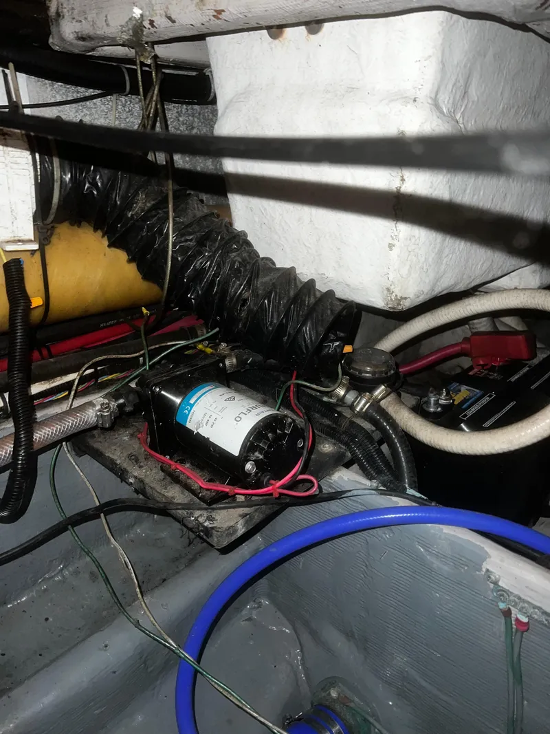 Slide: The Image of Engine compartment of a 2000 Wellcraft 330 Coastal boat, showing wiring and components. - 22