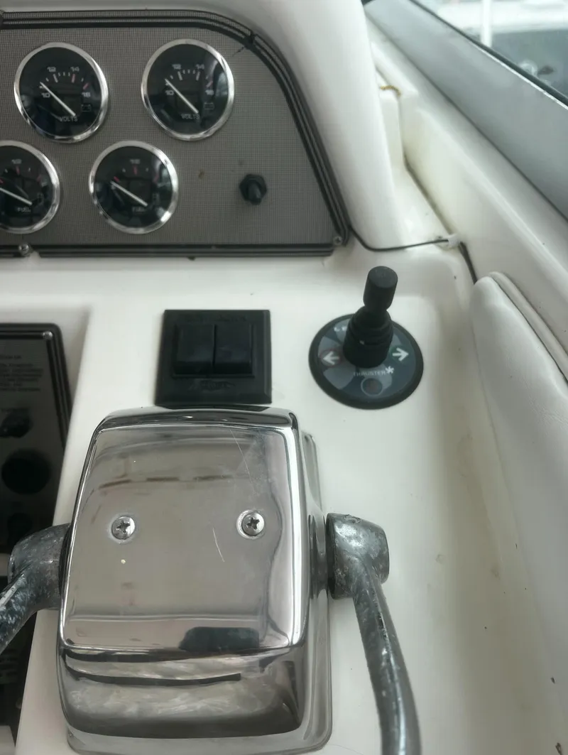 Slide: The Image of Close-up of 2000 Wellcraft 330 Coastal boat dashboard with controls and gauges. - 23