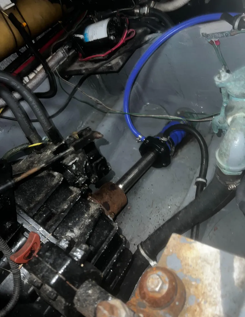 Slide: The Image of Engine compartment of a 2000 Wellcraft 330 Coastal boat, showing mechanical components and wiring. - 29