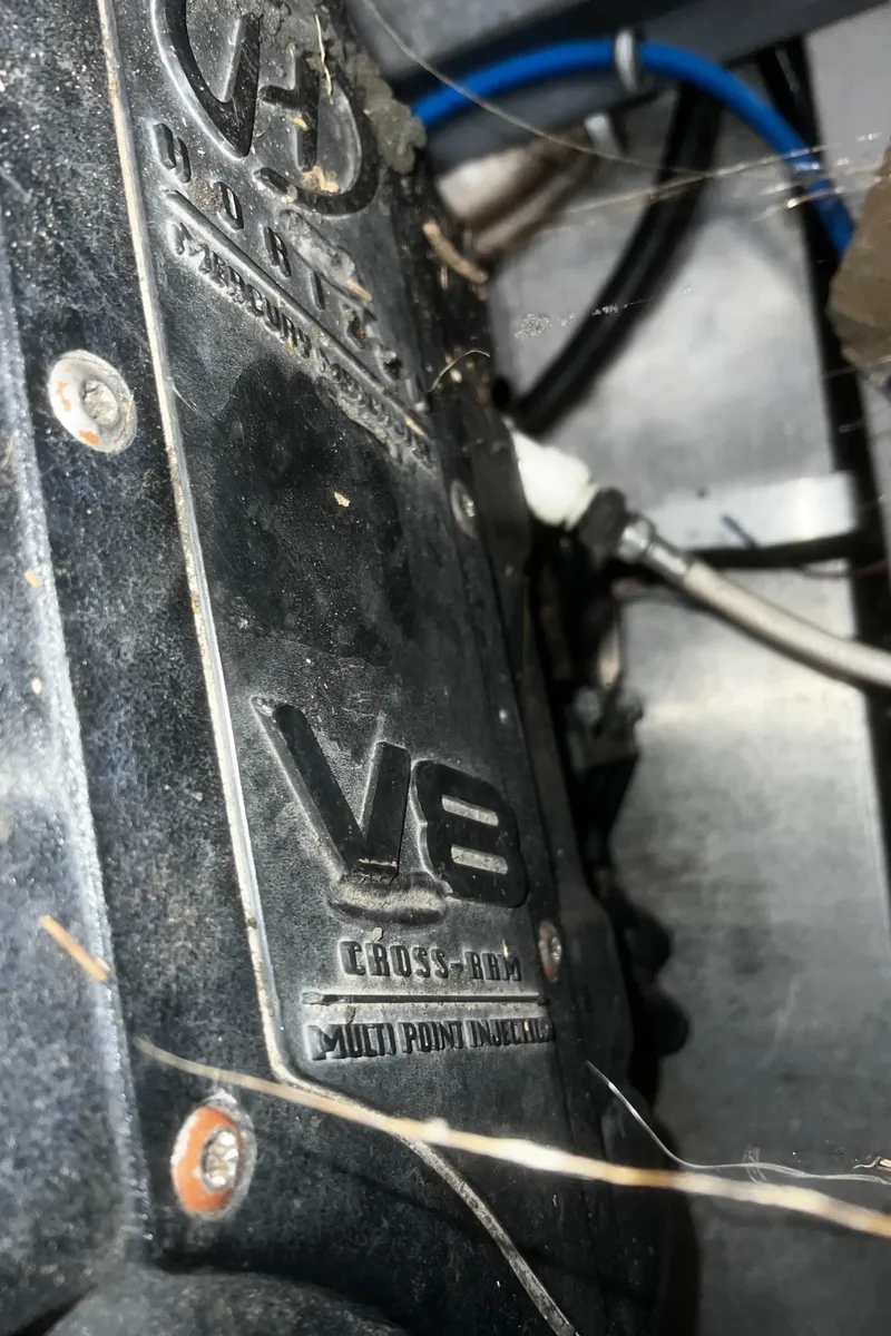 Slide: The Image of Close-up of a V8 engine in a 2000 Wellcraft 330 Coastal boat. - 30