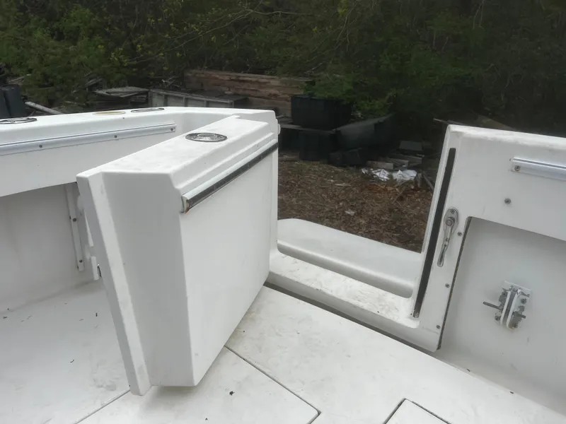 Slide: The Image of 2000 Wellcraft 330 Coastal boat interior with open storage compartment. - 31