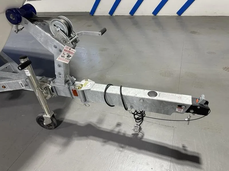 Slide: The Image of Trailer hitch for 2025 Boston Whaler 170 Montauk boat, parked indoors. - 11