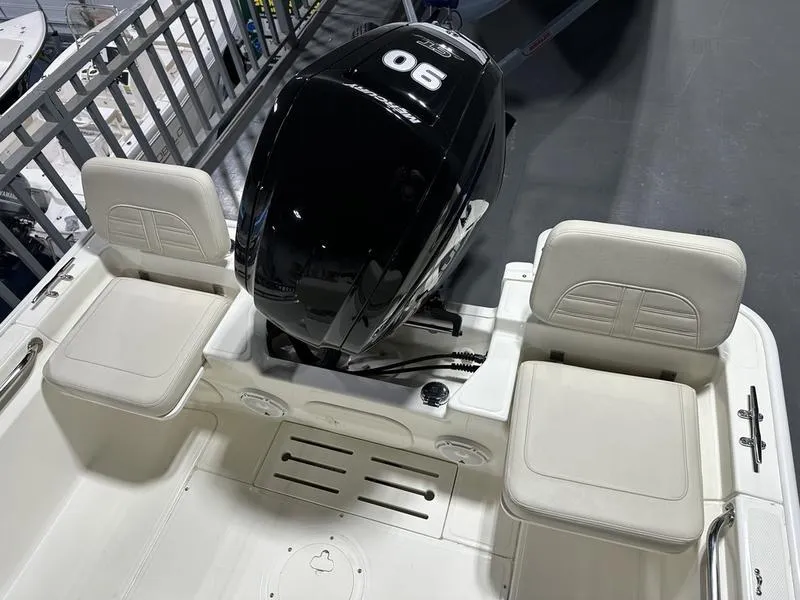 Slide: The Image of 2025 Boston Whaler 170 Montauk boat with dual seating and powerful outboard motor. - 8