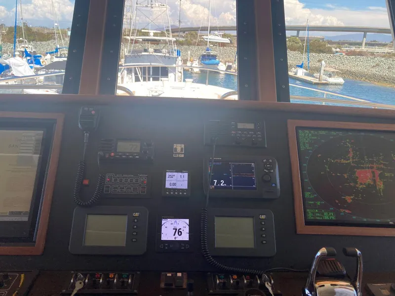 Slide: The Image of Allseas Expedition 92 2016 yacht control panel with navigation instruments and marina view. - 19