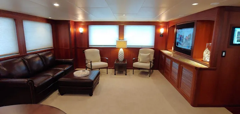 Slide: The Image of Luxurious living area in 2016 Allseas Expedition 92 yacht with leather sofa and flat-screen TV. - 2