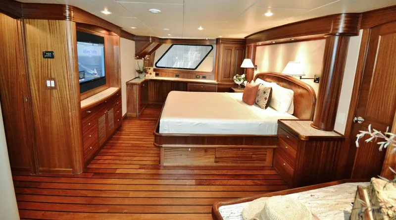 Slide: The Image of Luxurious master bedroom on the 2016 Allseas Expedition 92 yacht with wooden interiors. - 26
