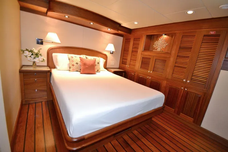 Slide: The Image of Luxurious bedroom on the 2016 Allseas Expedition 92 yacht with wooden decor. - 29