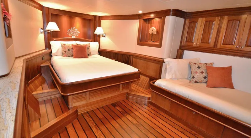 Slide: The Image of Luxurious wooden cabin interior of 2016 Allseas Expedition 92 yacht with bed and sofa. - 30