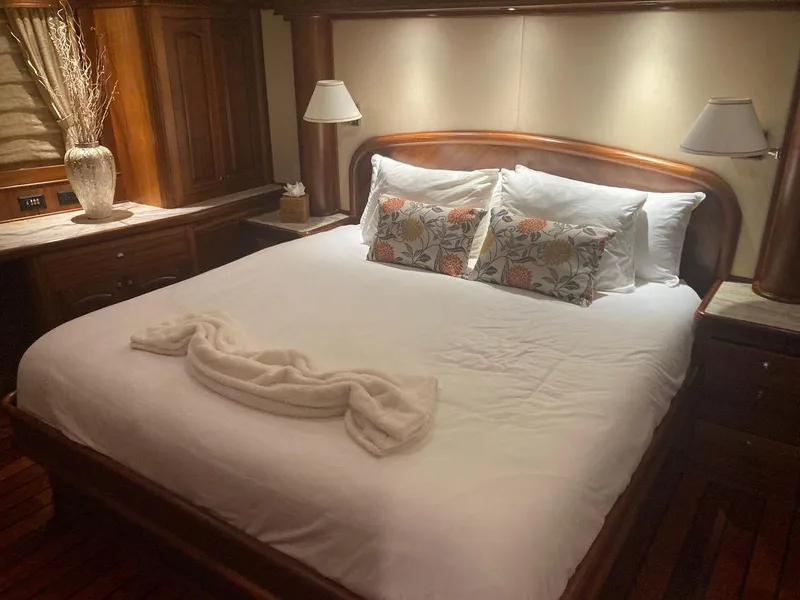Slide: The Image of Luxurious bedroom on 2016 Allseas Expedition 92 yacht with elegant wooden decor. - 32