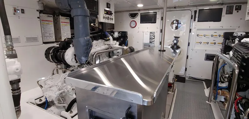 Slide: The Image of Engine room of 2016 Allseas Expedition 92 yacht with stainless steel surfaces and control panels. - 52