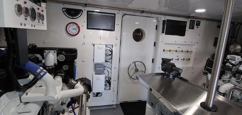 Slide: The Image of Engine room of 2016 Allseas Expedition 92 yacht with control panels and machinery. - 54