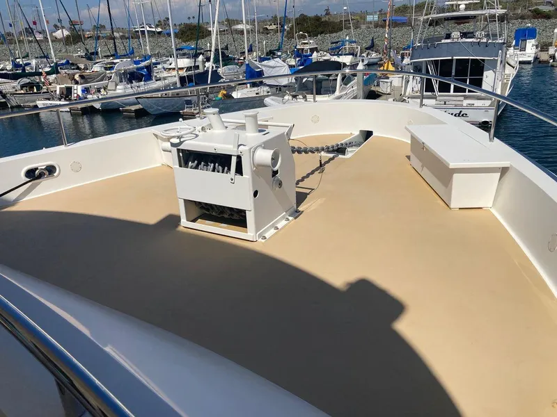 Slide: The Image of Allseas Expedition 92 yacht deck, 2016 model, docked at a marina with other boats. - 8