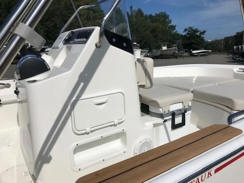 Slide: The Image of 2025 Boston Whaler 170 Montauk boat interior with console and seating. - 12