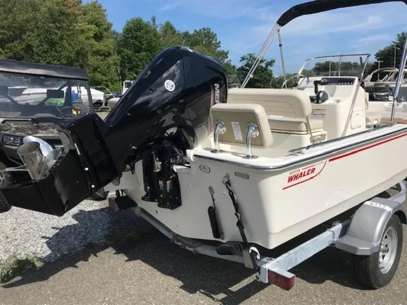 Slide: The Image of 2025 Boston Whaler 170 Montauk boat on trailer, outdoor setting. - 3