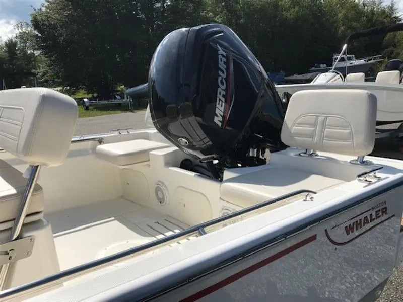 Slide: The Image of 2025 Boston Whaler 170 Montauk boat with Mercury engine, white interior seating. - 5