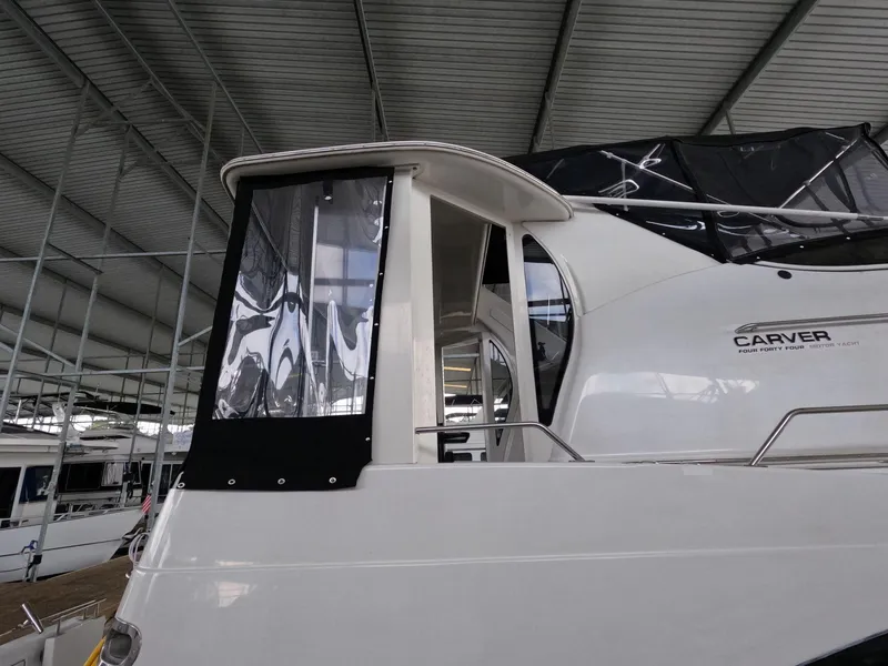 Slide: The Image of 2001 Carver 444 Cockpit Motor Yacht under covered dock. - 13