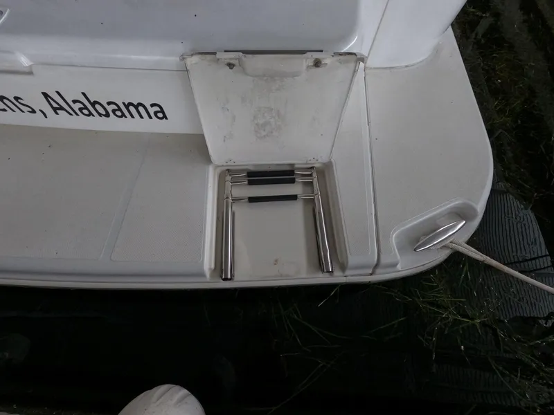 Slide: The Image of 2001 Carver 444 Cockpit Motor Yacht swim platform with foldable ladder. - 15