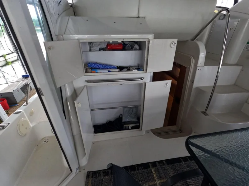 Slide: The Image of Open storage compartments on a 2001 Carver 444 Cockpit Motor Yacht. - 23