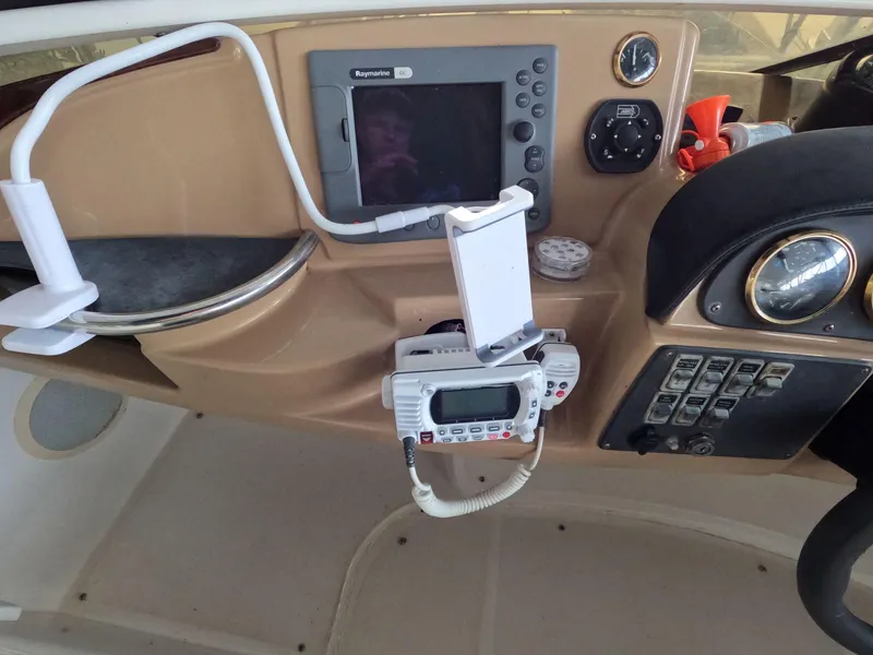 Slide: The Image of Control panel of a 2001 Carver 444 Cockpit Motor Yacht with navigation equipment. - 30