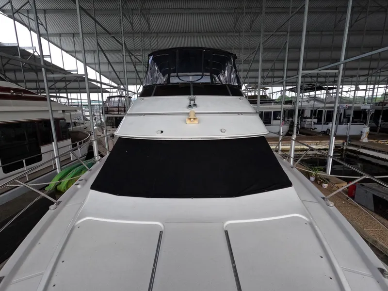 Slide: The Image of 2001 Carver 444 Cockpit Motor Yacht under covered dock. - 38
